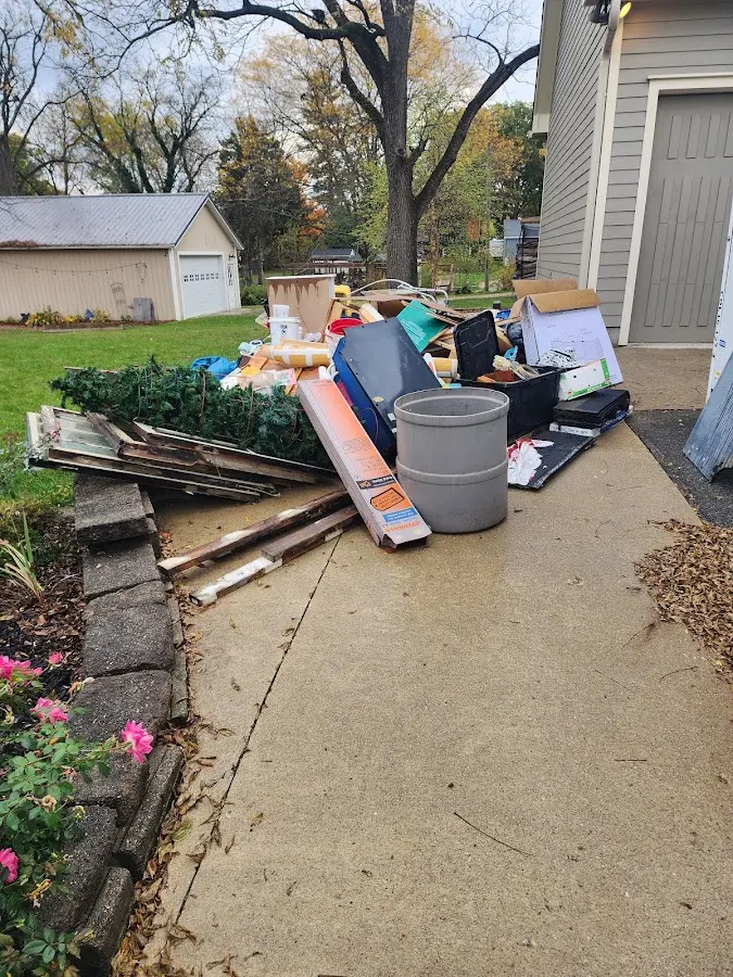 Dumpster being loaded with debris for Commercial Dumpster Rental in Stone Ridge